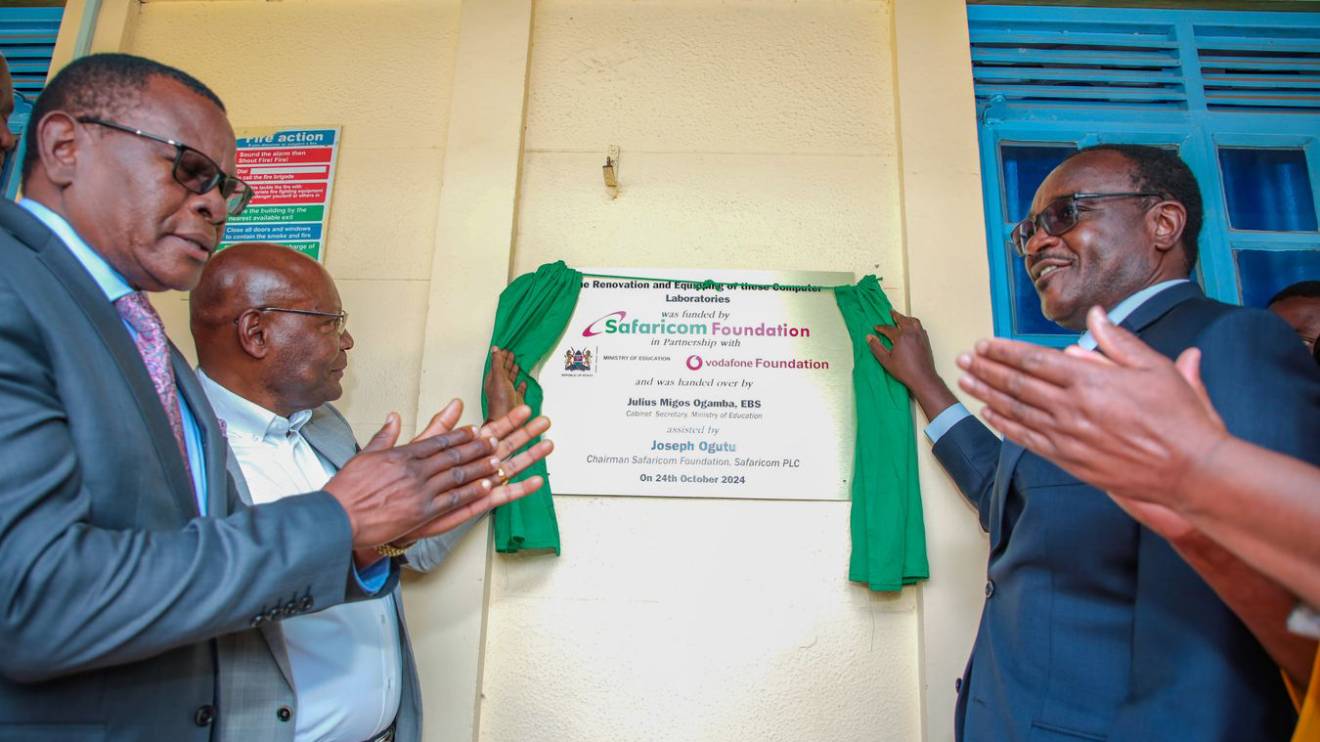 Julius Migos Ogamba (Right) and Joseph Ogutu (Left) officially launch a newly renovated ICT Lab at Machakos Teachers Training College during the launch of the Scaling Digital Skills program. PHOTO/COURTESY